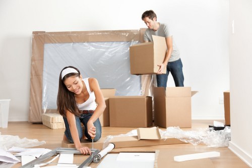 Customer placing items into a self-storage unit at Cheam Storage