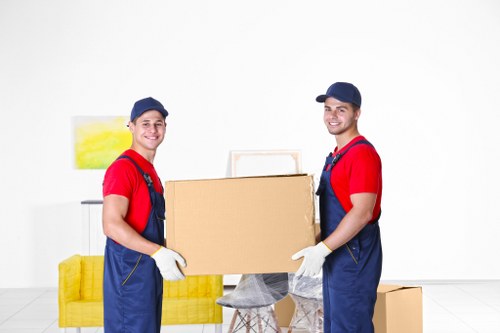 Professional house removals planning in Cheam with moving boxes and furniture