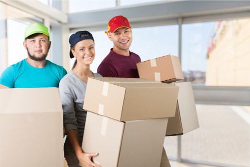 Moving van loading household furniture during house removals in Cheam