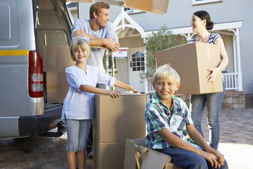 Professional movers handling boxes and furniture in Cheam